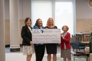 Big Check being delivered to Law Library Association for grant